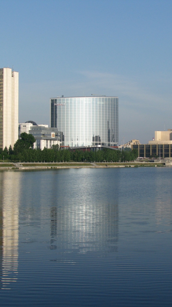 City Skyline Across Body of Water During Daytime. Wallpaper in 720x1280 Resolution