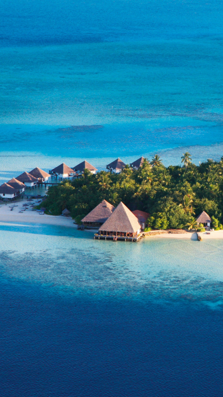 Brown and White House on Island Surrounded by Body of Water. Wallpaper in 750x1334 Resolution