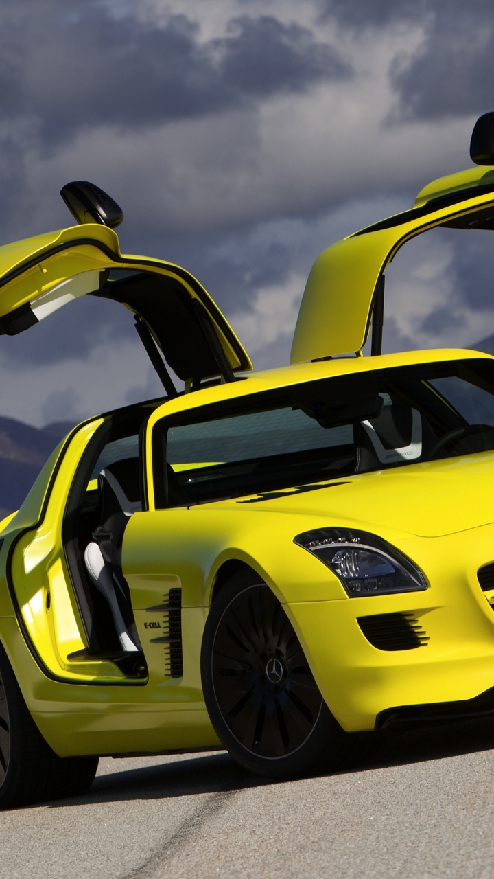 Yellow Porsche 911 on Grey Pavement. Wallpaper in 720x1280 Resolution