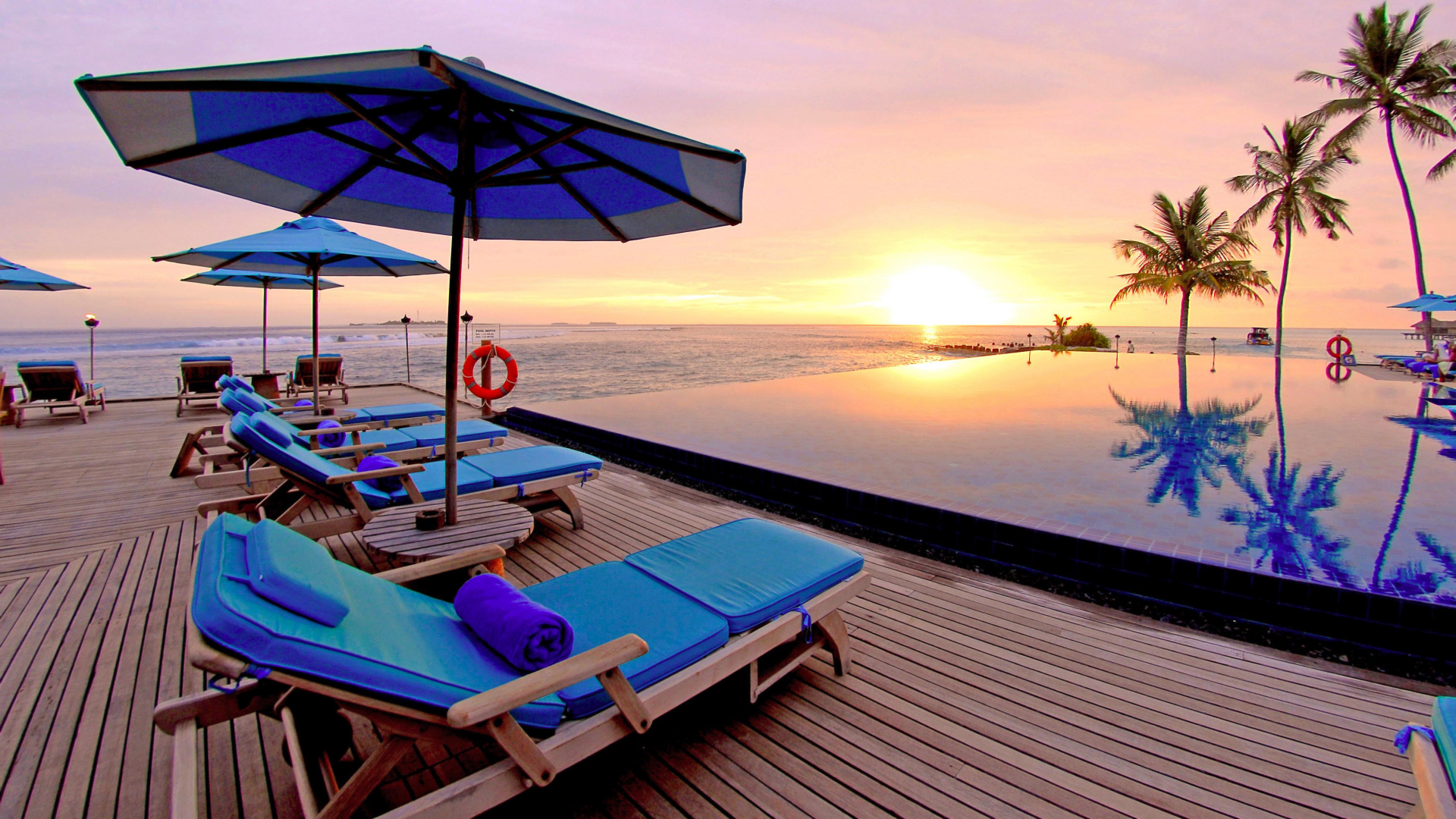 Blue and White Lounge Chairs on Beach During Sunset. Wallpaper in 1920x1080 Resolution