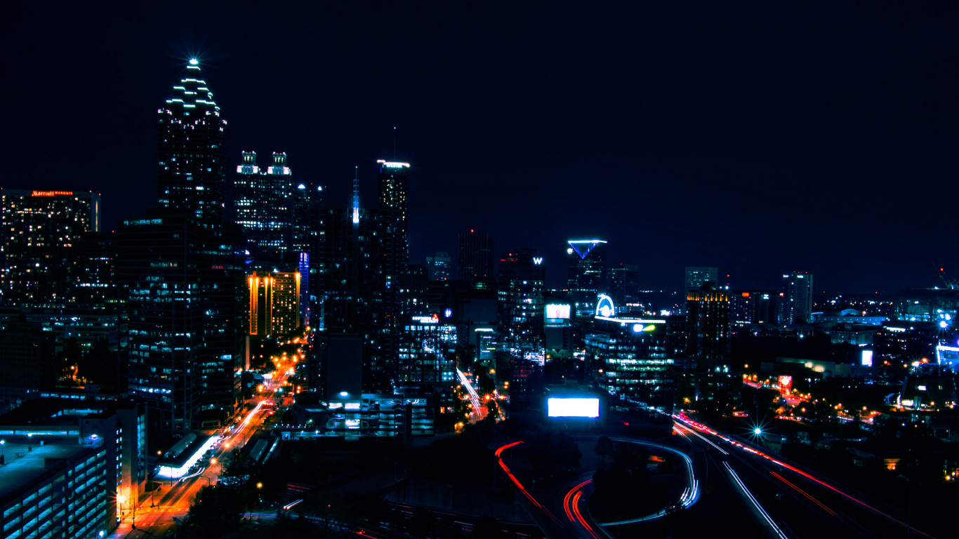 City With High Rise Buildings During Night Time. Wallpaper in 1366x768 Resolution