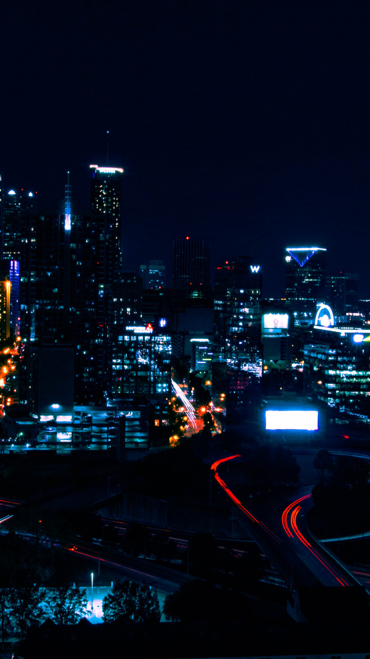 City With High Rise Buildings During Night Time. Wallpaper in 750x1334 Resolution