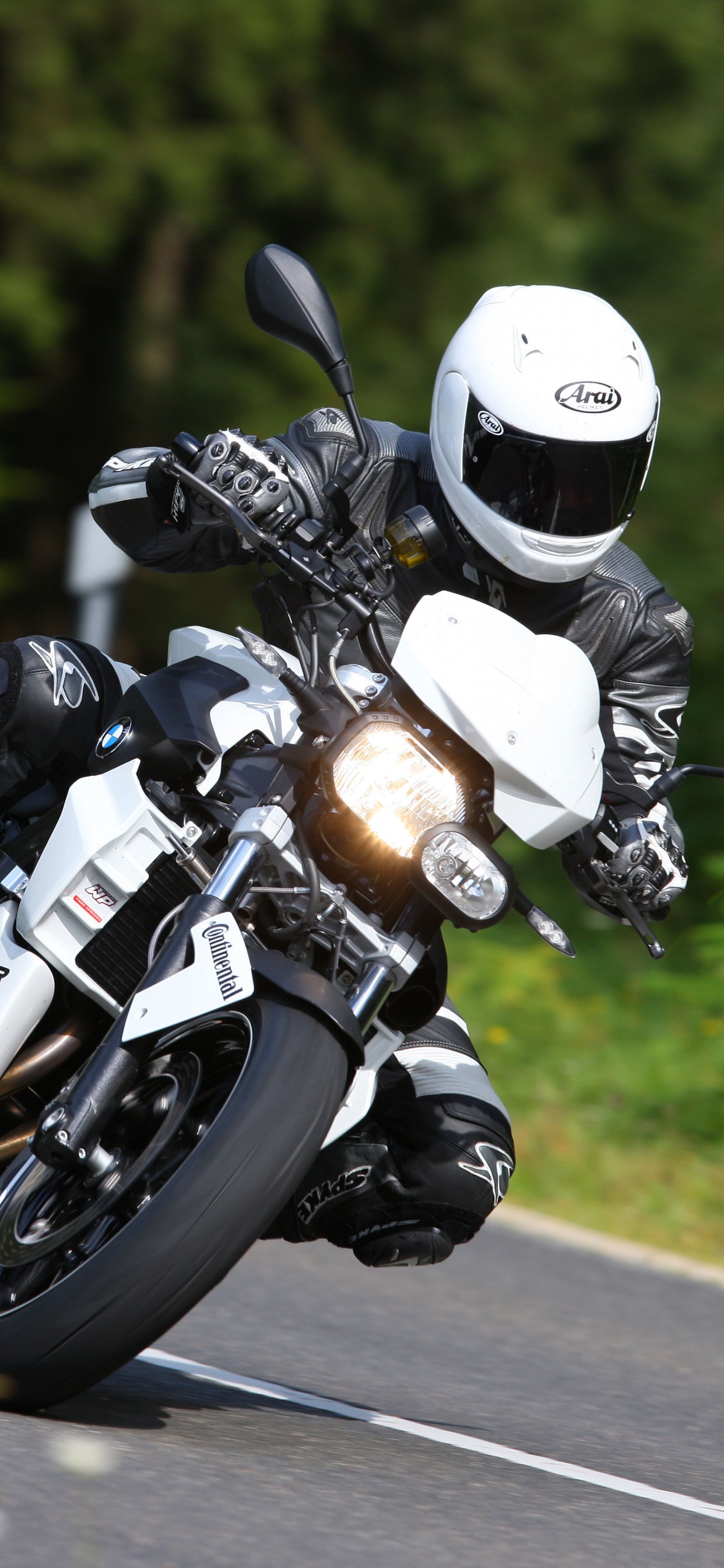Man in Black Helmet Riding Motorcycle on Road During Daytime. Wallpaper in 1242x2688 Resolution