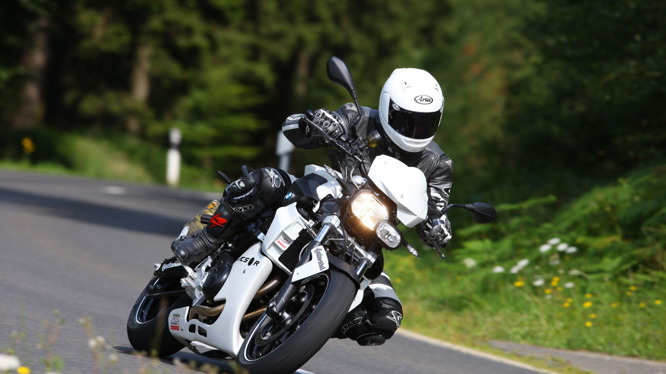 Man in Black Helmet Riding Motorcycle on Road During Daytime. Wallpaper in 1366x768 Resolution