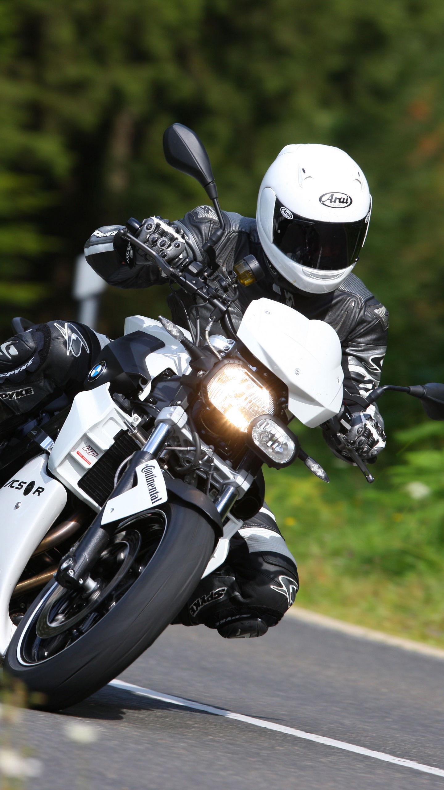 Man in Black Helmet Riding Motorcycle on Road During Daytime. Wallpaper in 1440x2560 Resolution