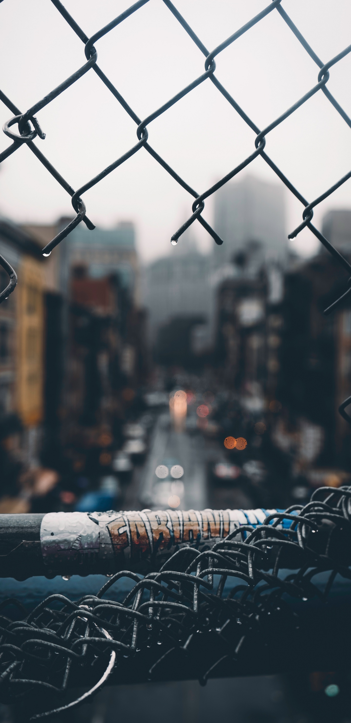 Grey Metal Fence With Water Droplets. Wallpaper in 1440x2960 Resolution