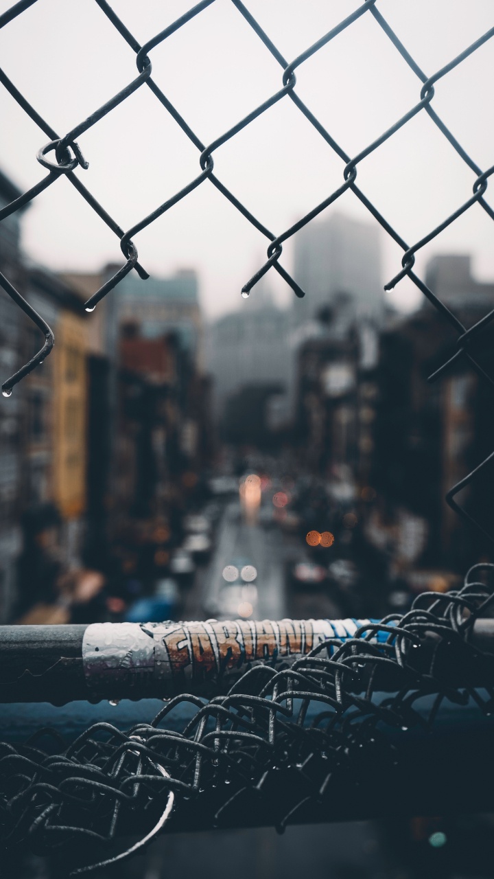 Grey Metal Fence With Water Droplets. Wallpaper in 720x1280 Resolution
