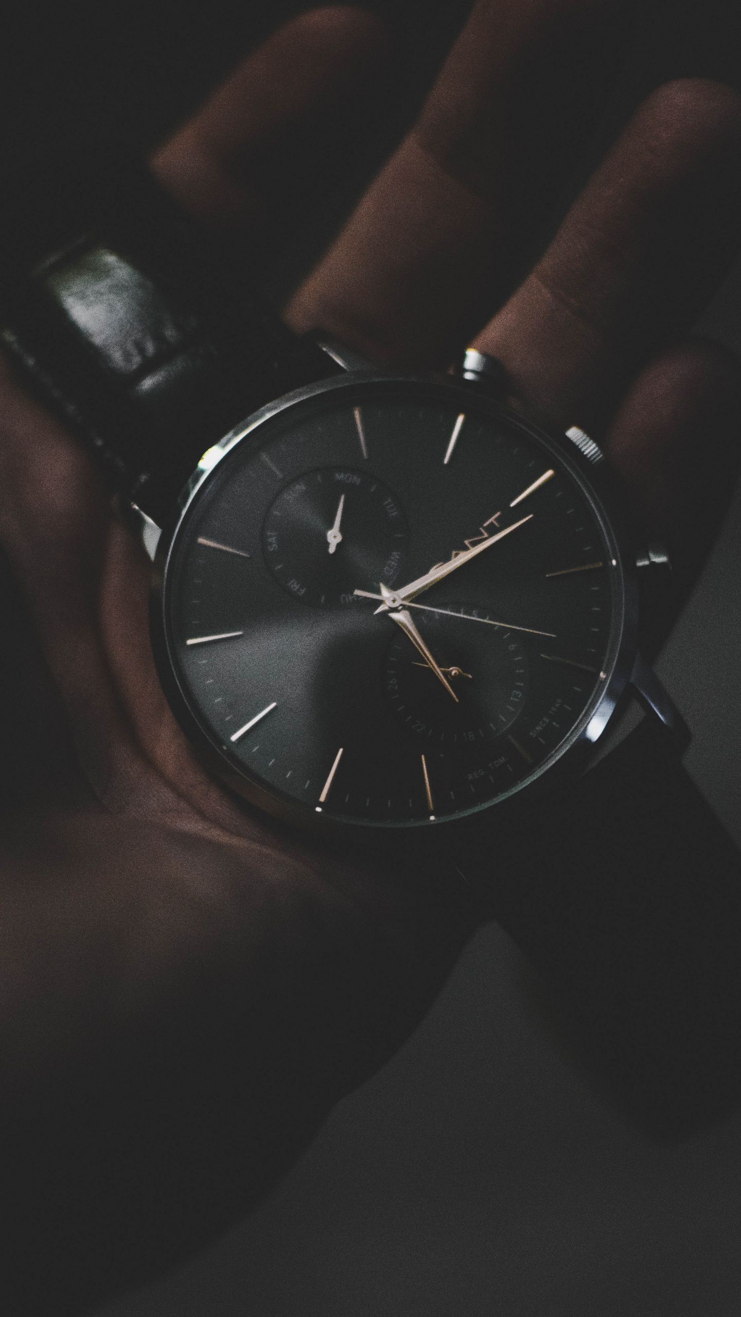 Person Holding Silver Round Analog Watch. Wallpaper in 1440x2560 Resolution