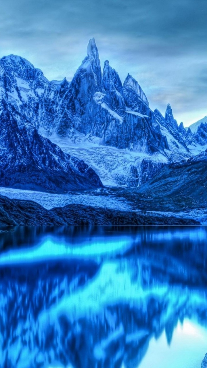 Snow Covered Mountain Near Lake During Daytime. Wallpaper in 720x1280 Resolution