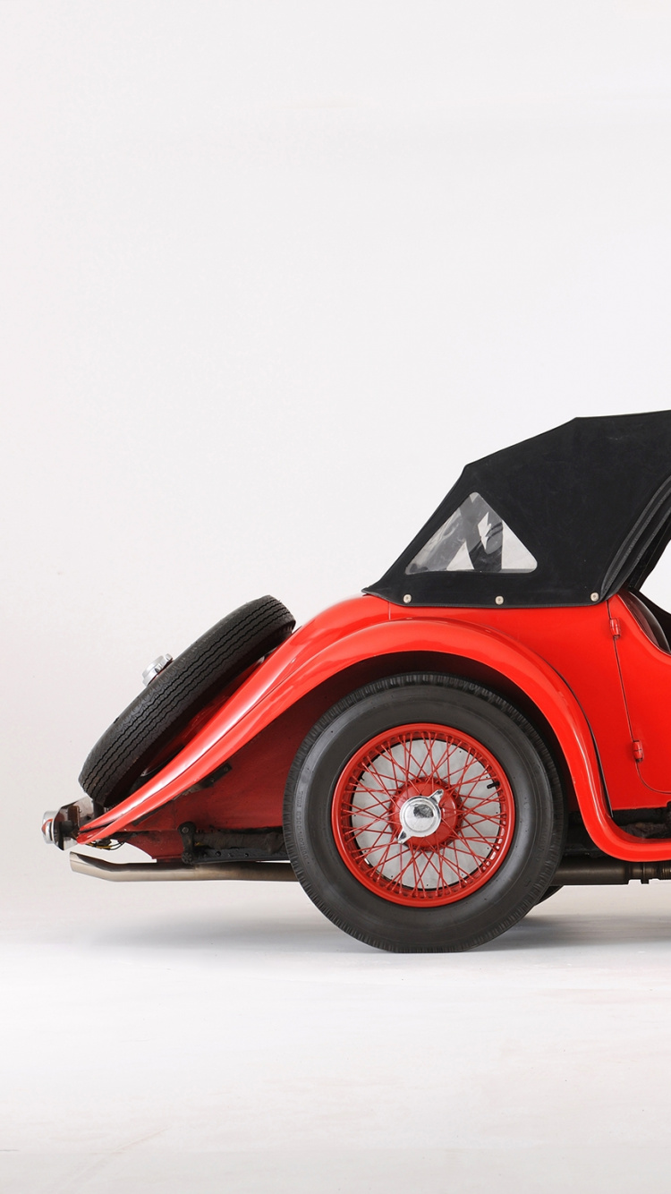 Red Vintage Car on White Snow. Wallpaper in 750x1334 Resolution