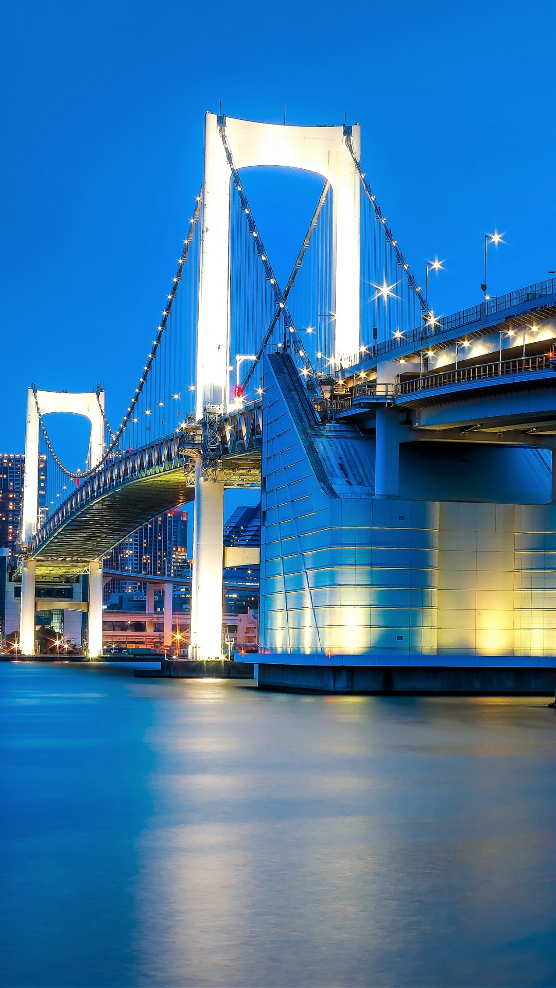 Bridge Over Water During Night Time. Wallpaper in 1080x1920 Resolution