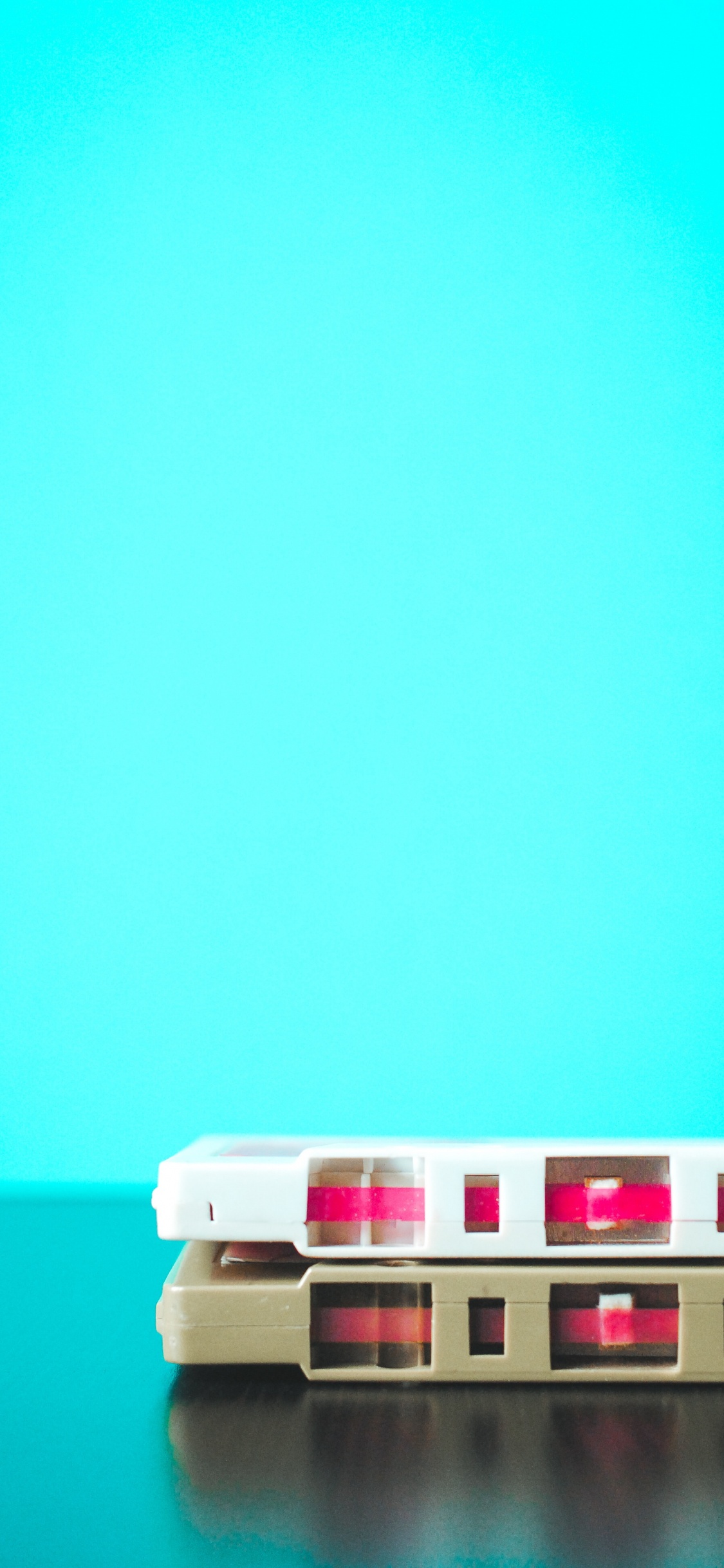 White and Red Plastic Toy. Wallpaper in 1125x2436 Resolution