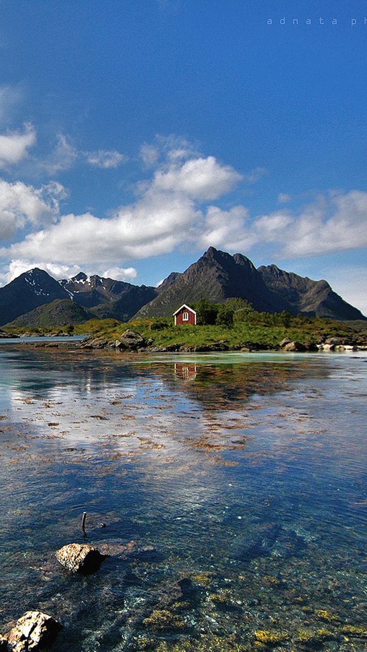 Body of Water Near Mountain Under Blue Sky During Daytime. Wallpaper in 720x1280 Resolution