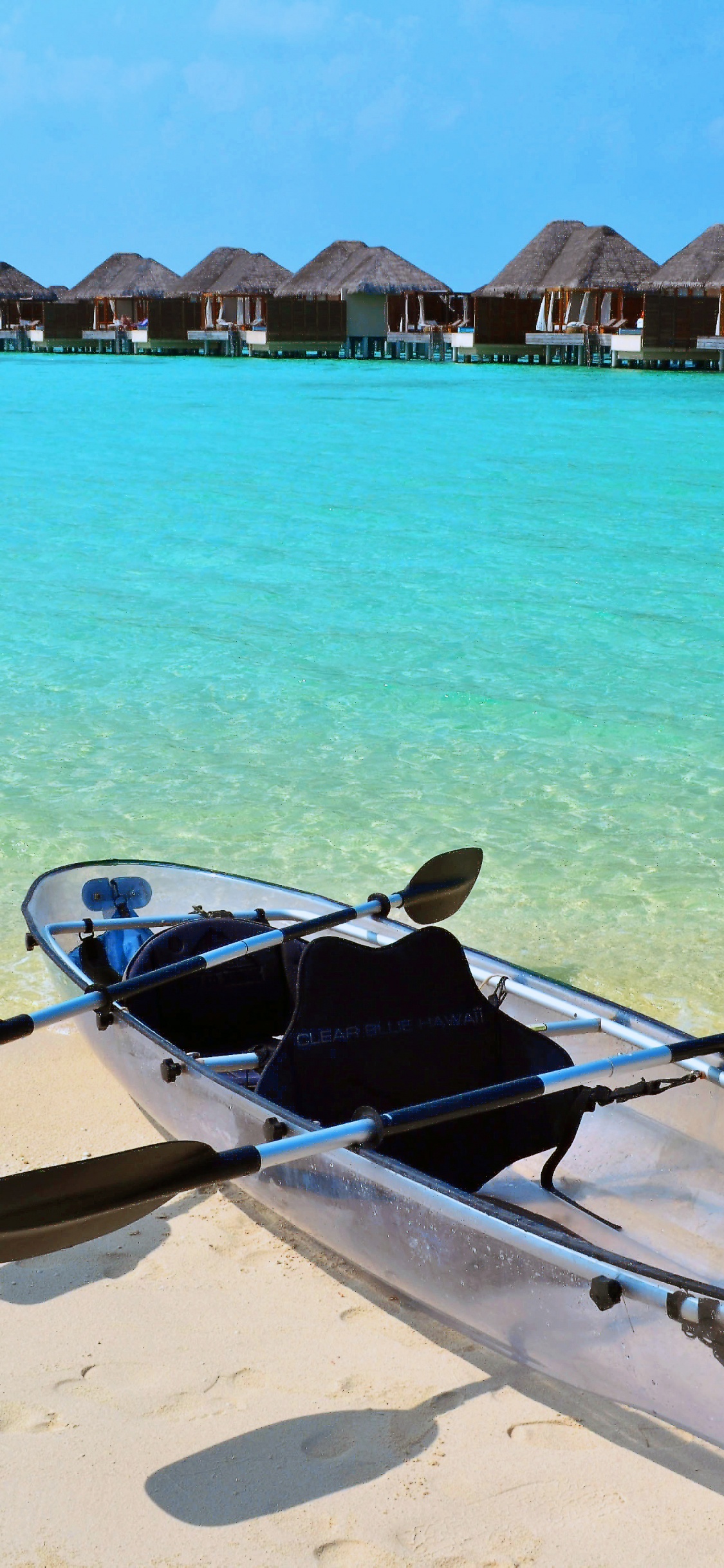 White and Black Boat on Beach During Daytime. Wallpaper in 1125x2436 Resolution