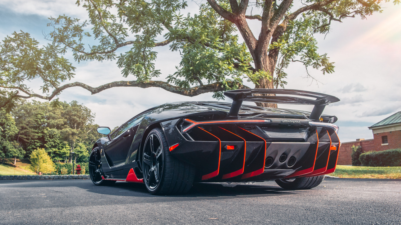 Black and Red Porsche 911 Parked on Gray Asphalt Road During Daytime. Wallpaper in 1366x768 Resolution