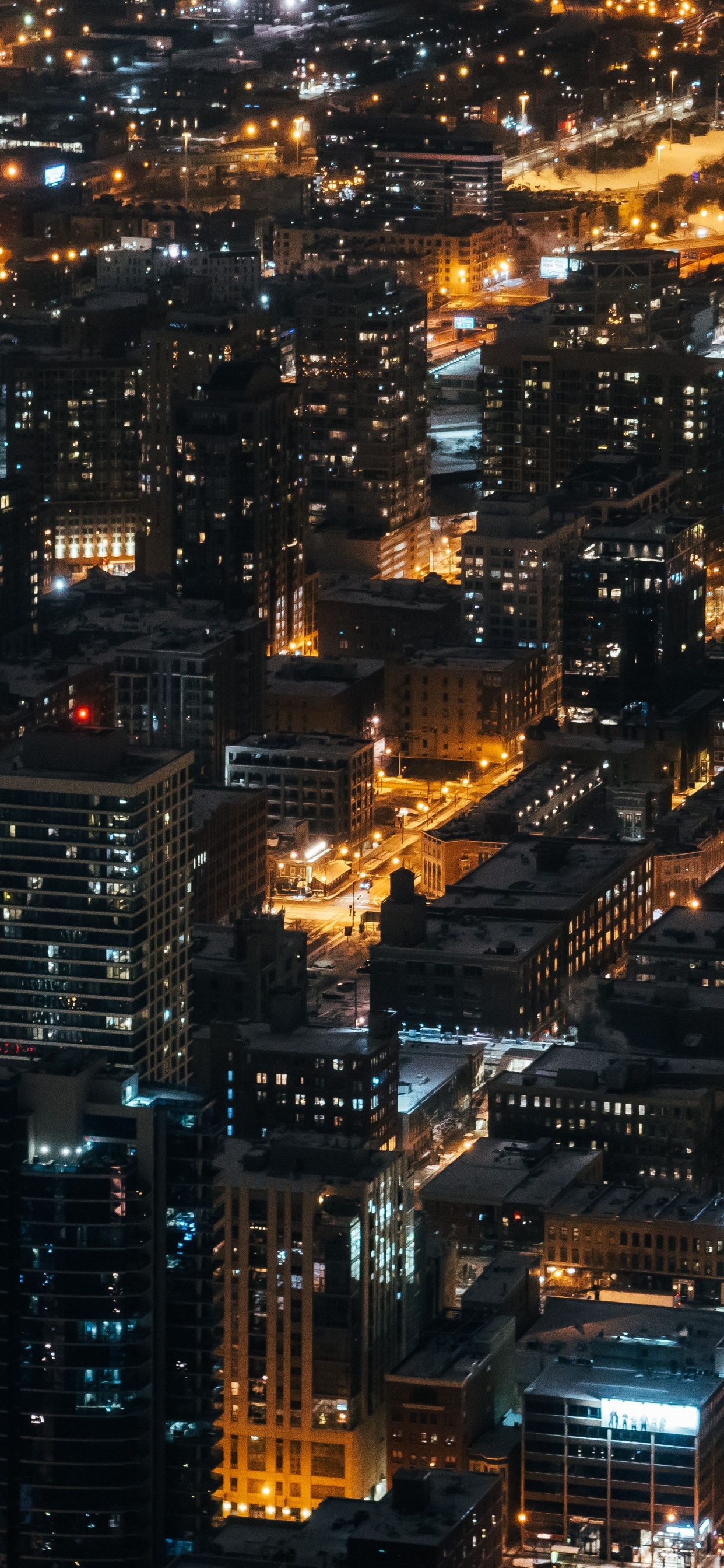 Vue Aérienne Des Bâtiments de la Ville Pendant la Nuit. Wallpaper in 1242x2688 Resolution