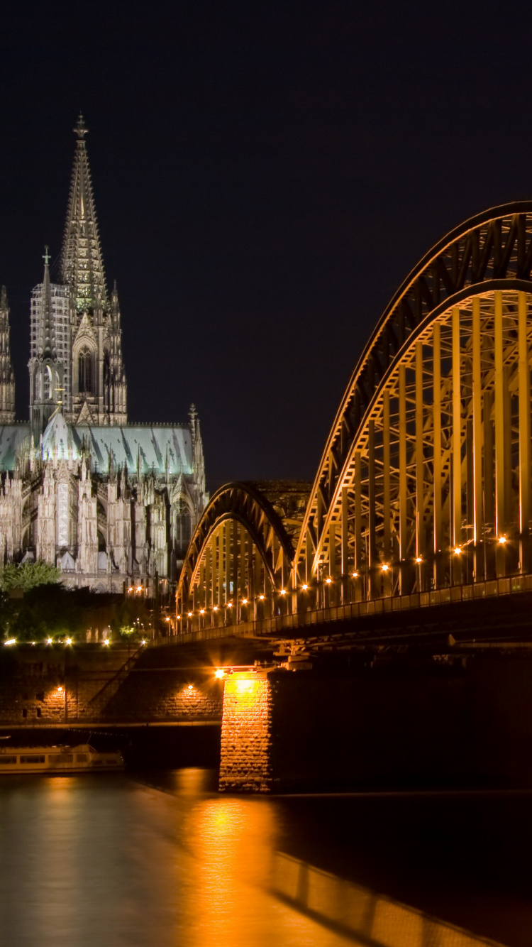Bridge Over Water During Night Time. Wallpaper in 750x1334 Resolution