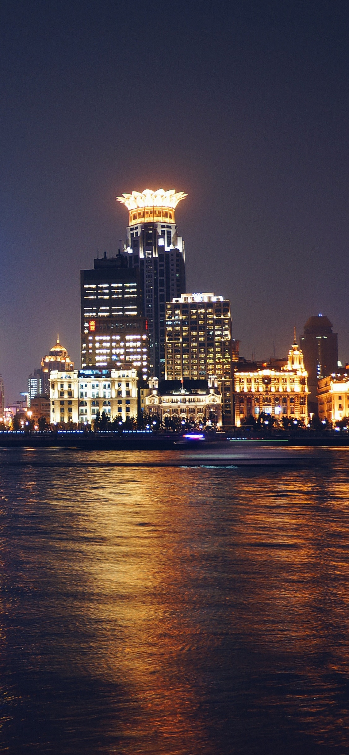 City Skyline During Night Time. Wallpaper in 1125x2436 Resolution