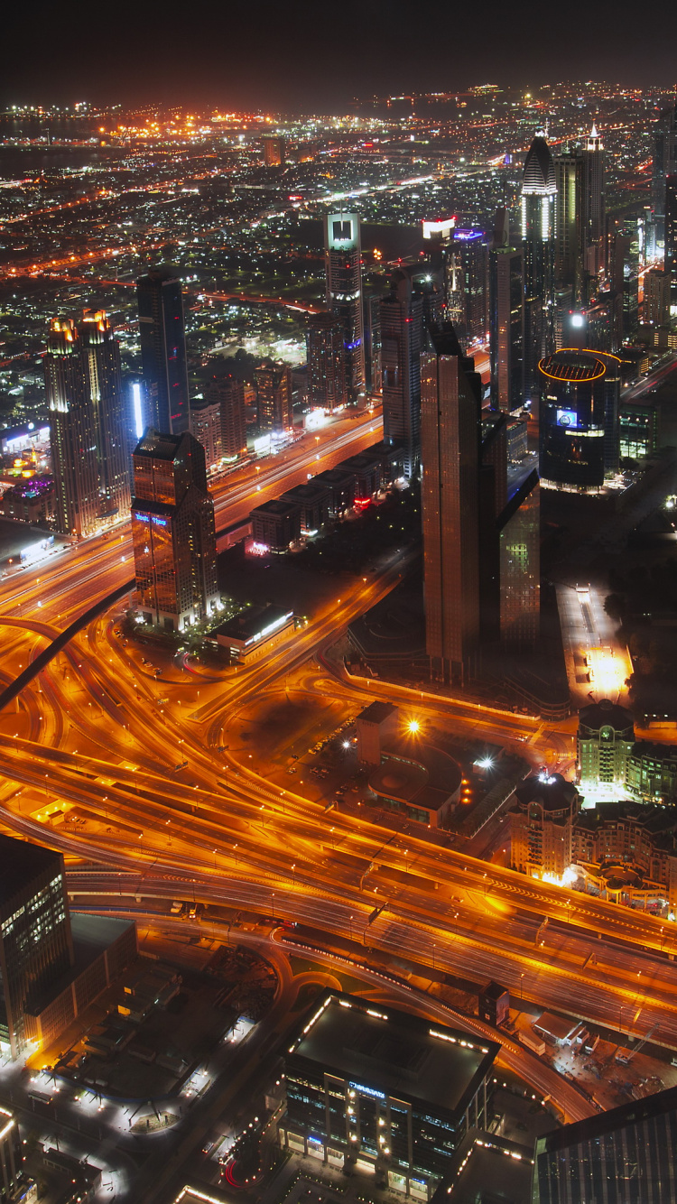 City With High Rise Buildings During Night Time. Wallpaper in 750x1334 Resolution