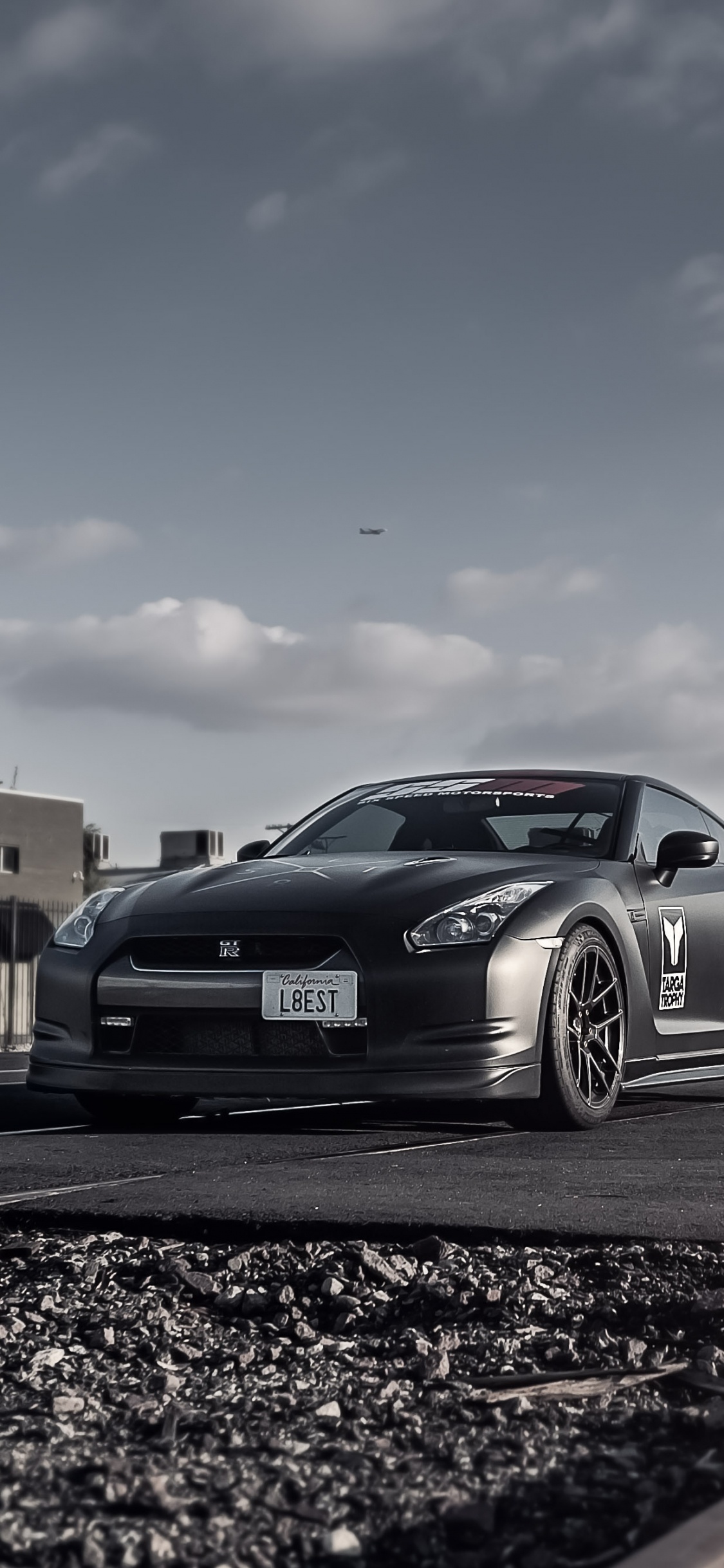 Black Sedan Parked on Side of Road During Daytime. Wallpaper in 1125x2436 Resolution