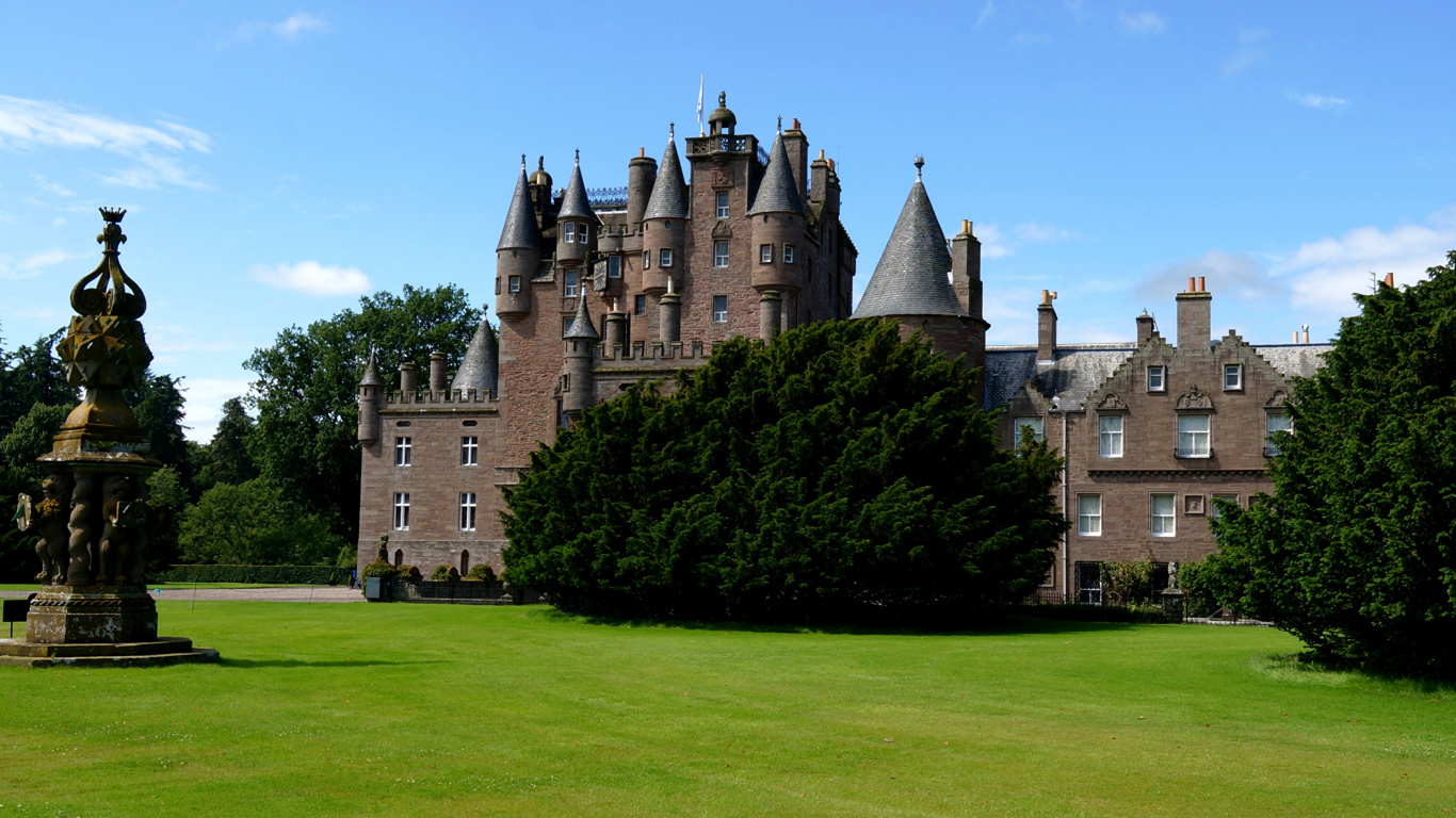 Brown Concrete Castle Surrounded by Green Grass Field Under Blue Sky During Daytime. Wallpaper in 1366x768 Resolution