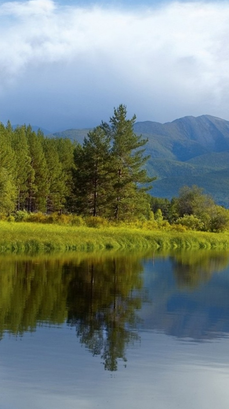 Green Trees Near Lake Under White Clouds and Blue Sky During Daytime. Wallpaper in 750x1334 Resolution