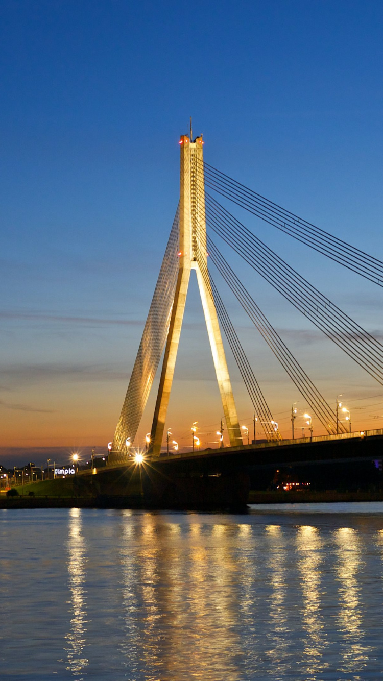 Bridge Over Water During Night Time. Wallpaper in 750x1334 Resolution