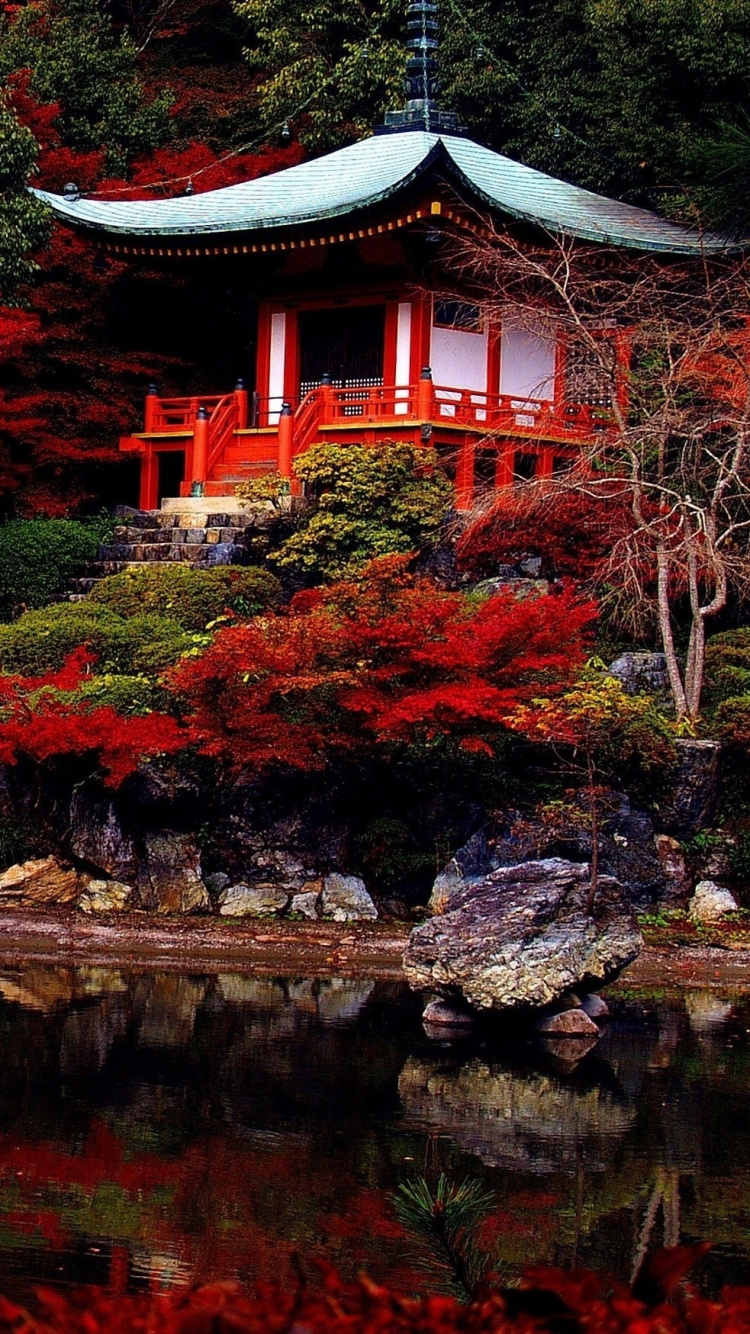 Red and Brown Wooden Bridge Over River. Wallpaper in 750x1334 Resolution