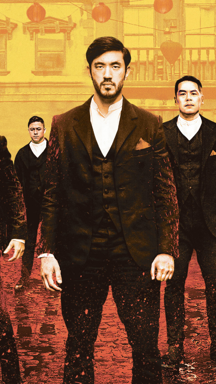 3 Men in Black Suit Standing Near Building. Wallpaper in 750x1334 Resolution