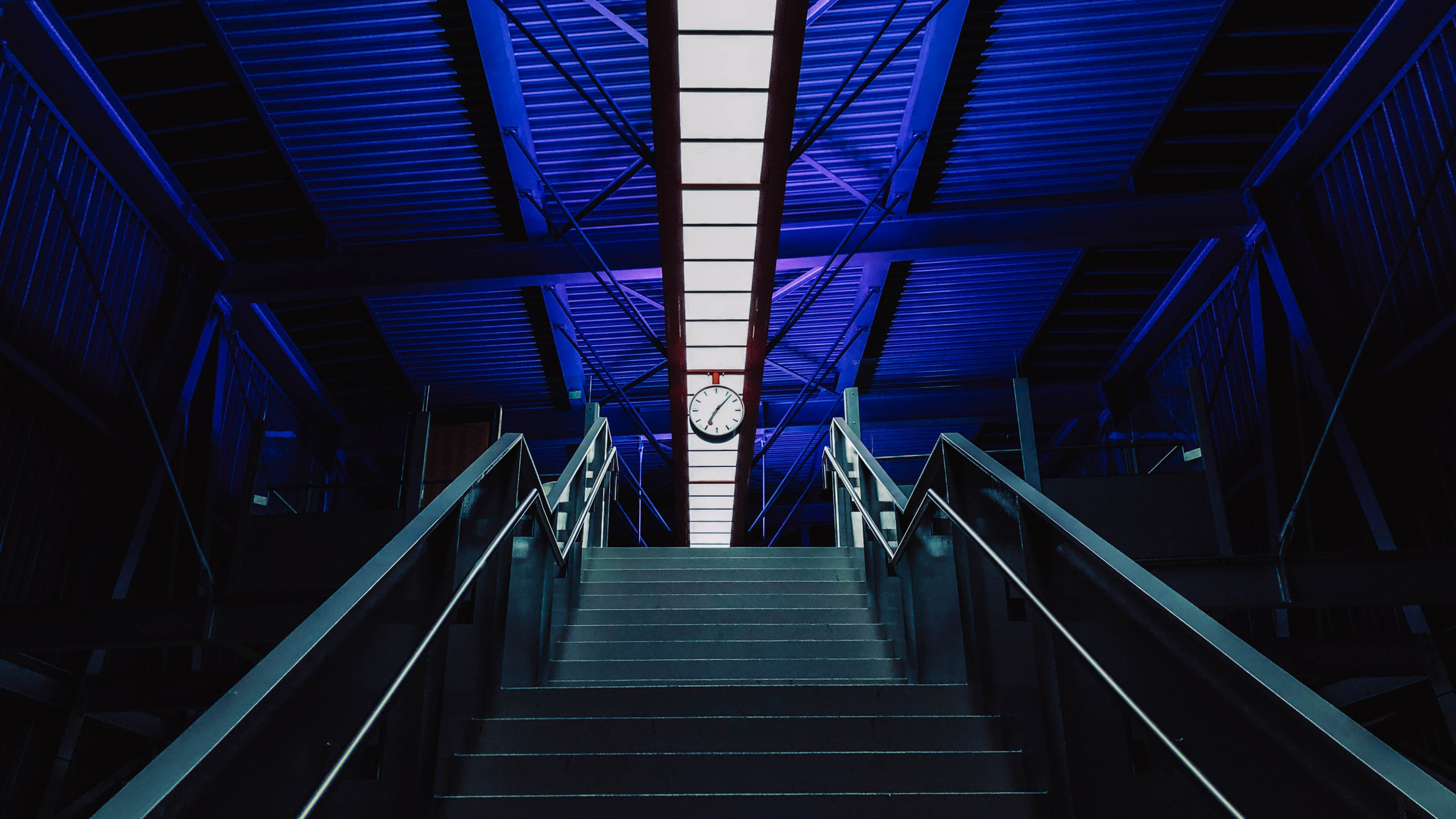 Brown Wooden Staircase With Stainless Steel Railings. Wallpaper in 2560x1440 Resolution