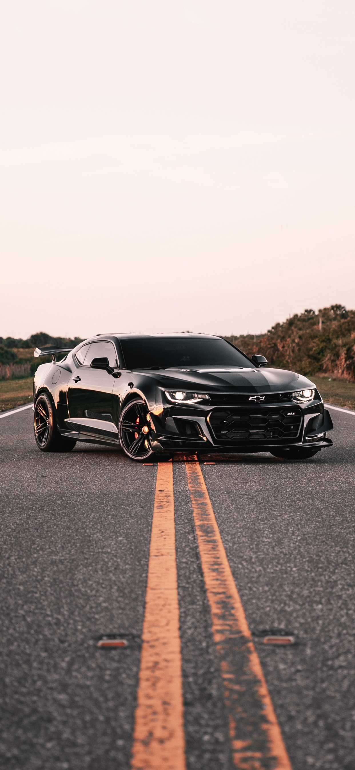 Black and White Sports Car on Road During Daytime. Wallpaper in 1242x2688 Resolution