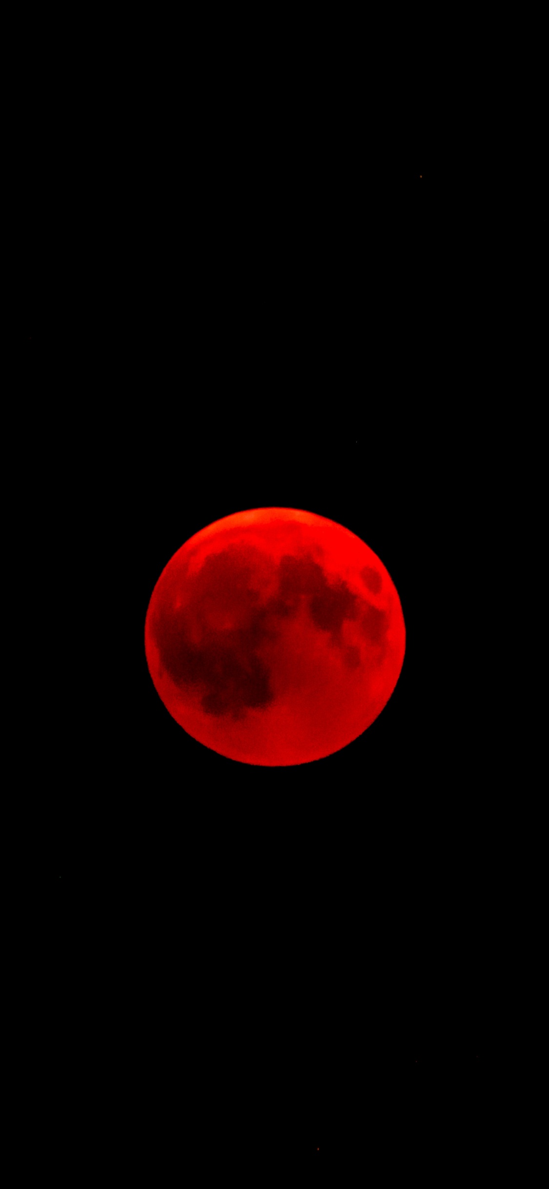 Red Moon in Black Background. Wallpaper in 1125x2436 Resolution