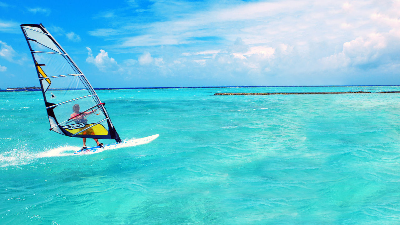 Yellow and White Sail Boat on Blue Sea Under Blue Sky During Daytime. Wallpaper in 1280x720 Resolution
