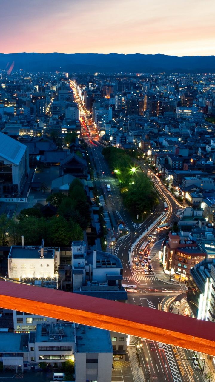 City With High Rise Buildings During Night Time. Wallpaper in 720x1280 Resolution