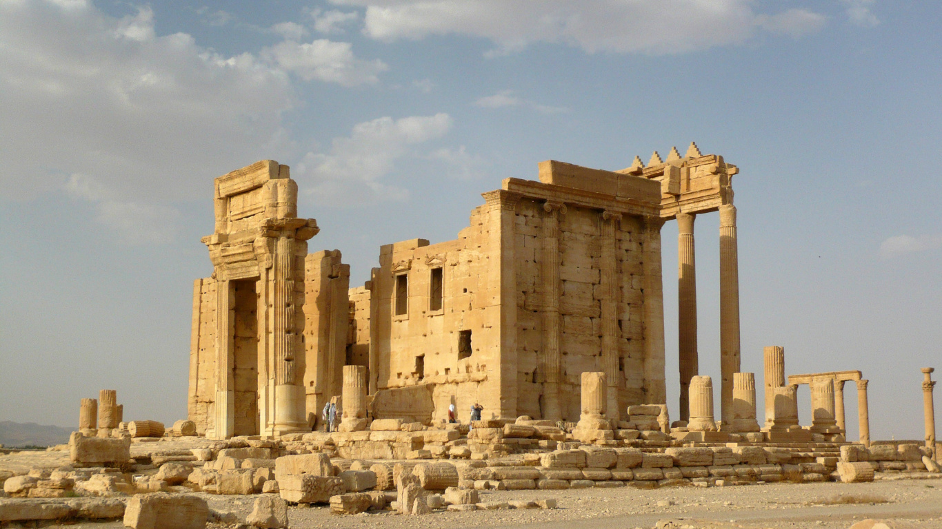 Brown Concrete Building Under Blue Sky During Daytime. Wallpaper in 1366x768 Resolution