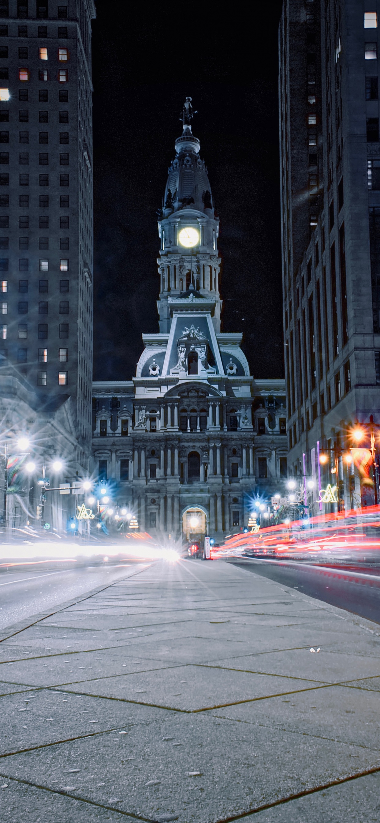 Cars on Road Near High Rise Buildings During Night Time. Wallpaper in 1242x2688 Resolution