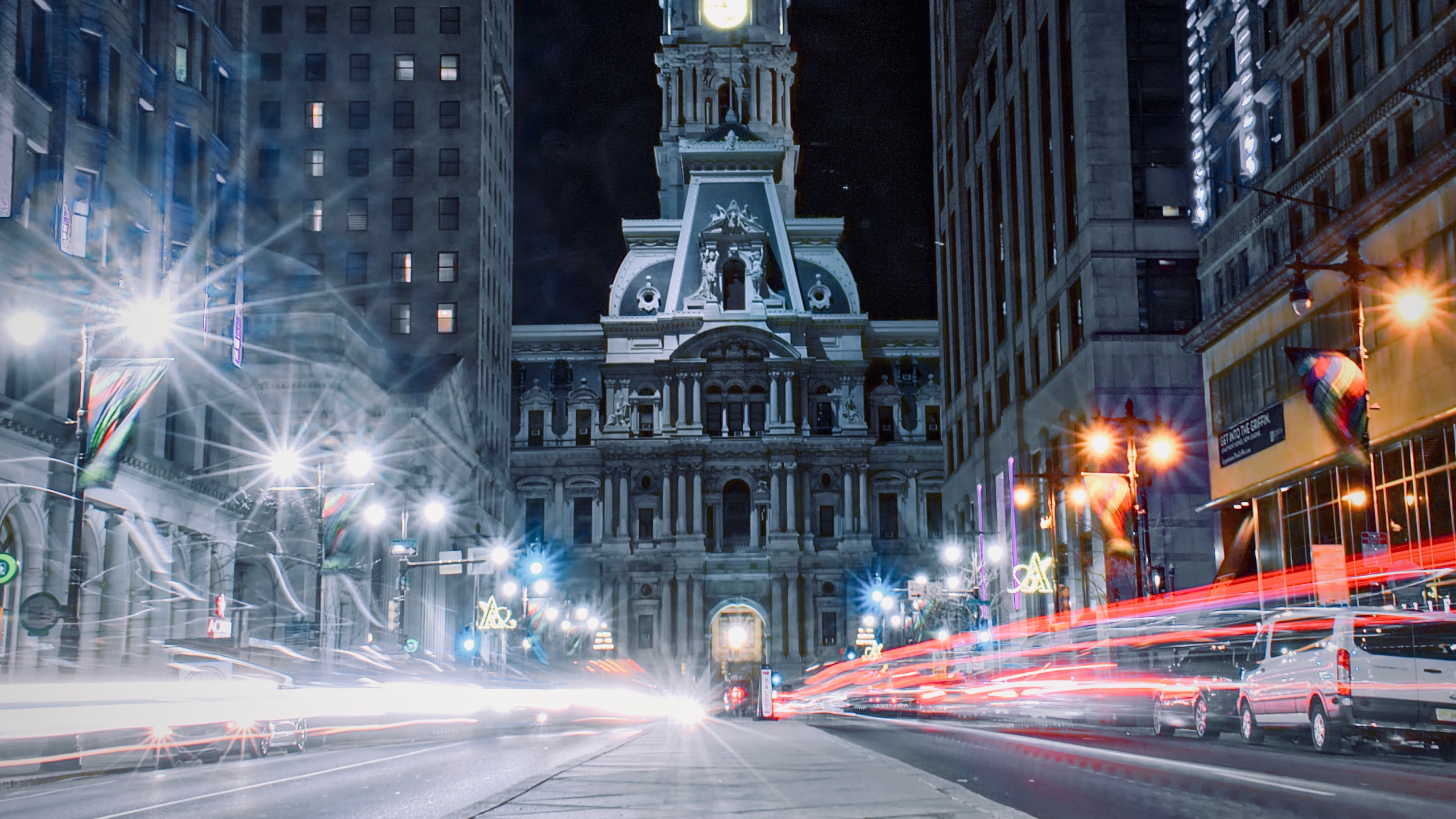Cars on Road Near High Rise Buildings During Night Time. Wallpaper in 2560x1440 Resolution