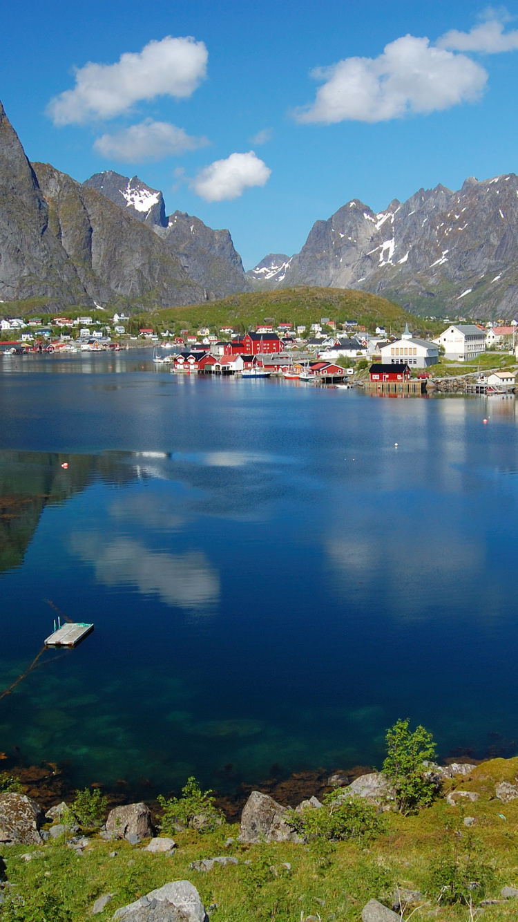 Houses Near Lake and Mountain Range Under Blue Sky During Daytime. Wallpaper in 750x1334 Resolution