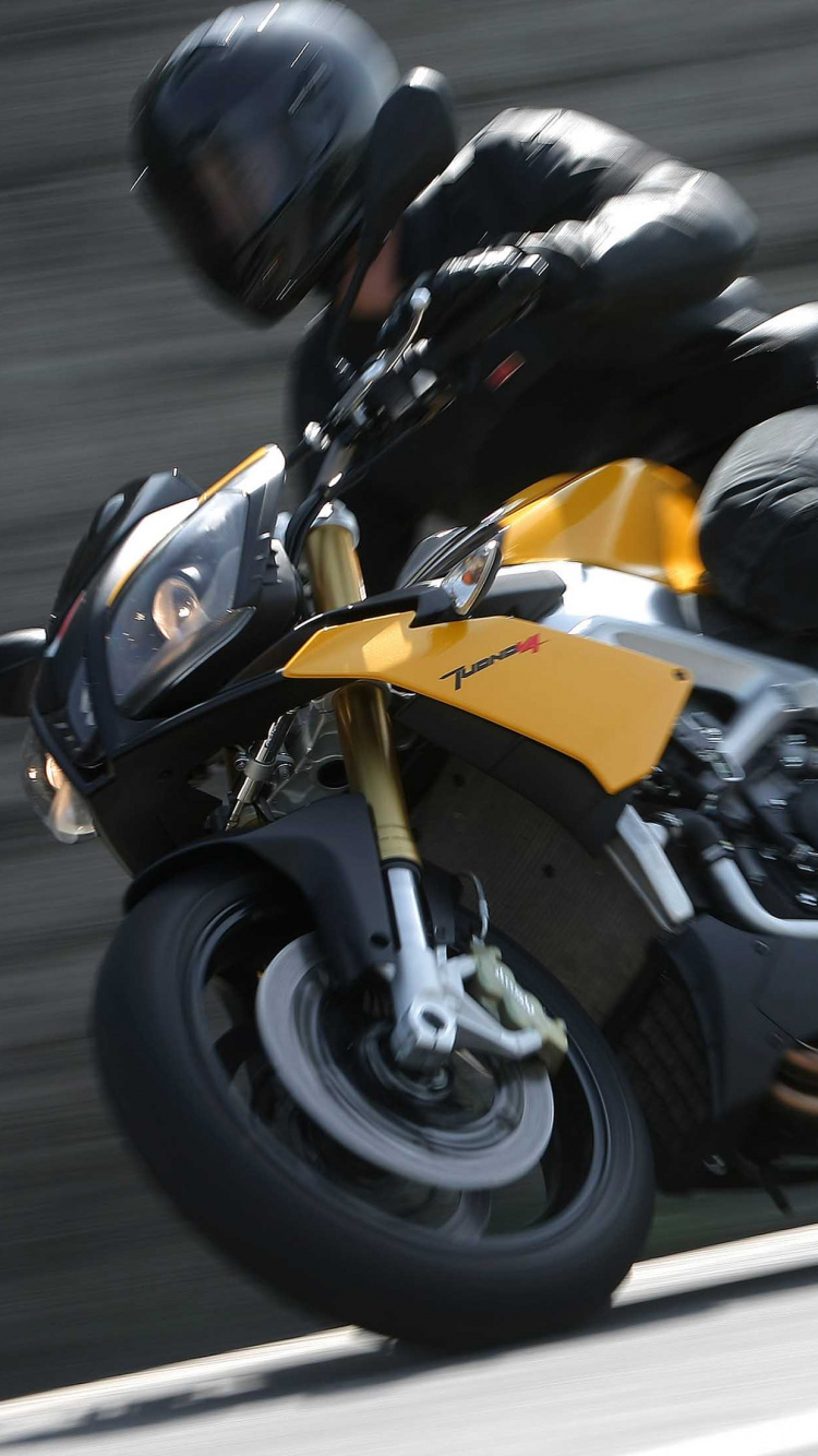 Man in Black Jacket Riding Yellow Sports Bike. Wallpaper in 750x1334 Resolution