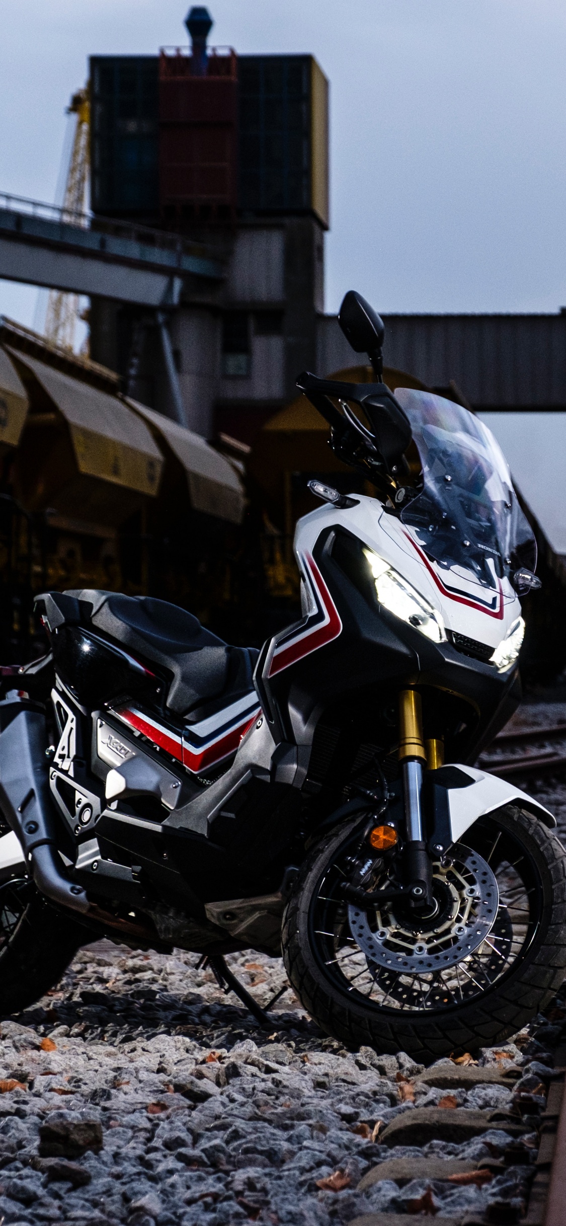 White and Black Sports Bike Parked on Road Side During Daytime. Wallpaper in 1125x2436 Resolution