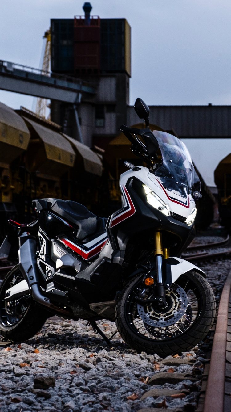 White and Black Sports Bike Parked on Road Side During Daytime. Wallpaper in 750x1334 Resolution