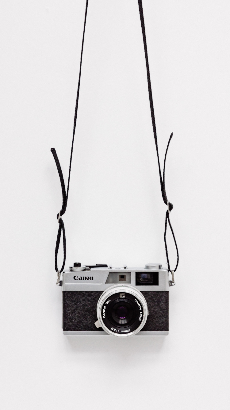 Black and Silver Point and Shoot Camera. Wallpaper in 750x1334 Resolution