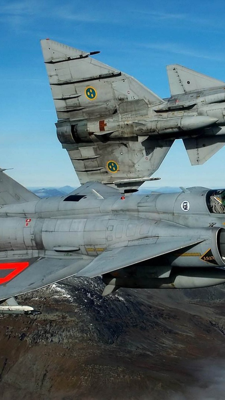 Gray Fighter Jet on Brown Mountain During Daytime. Wallpaper in 720x1280 Resolution