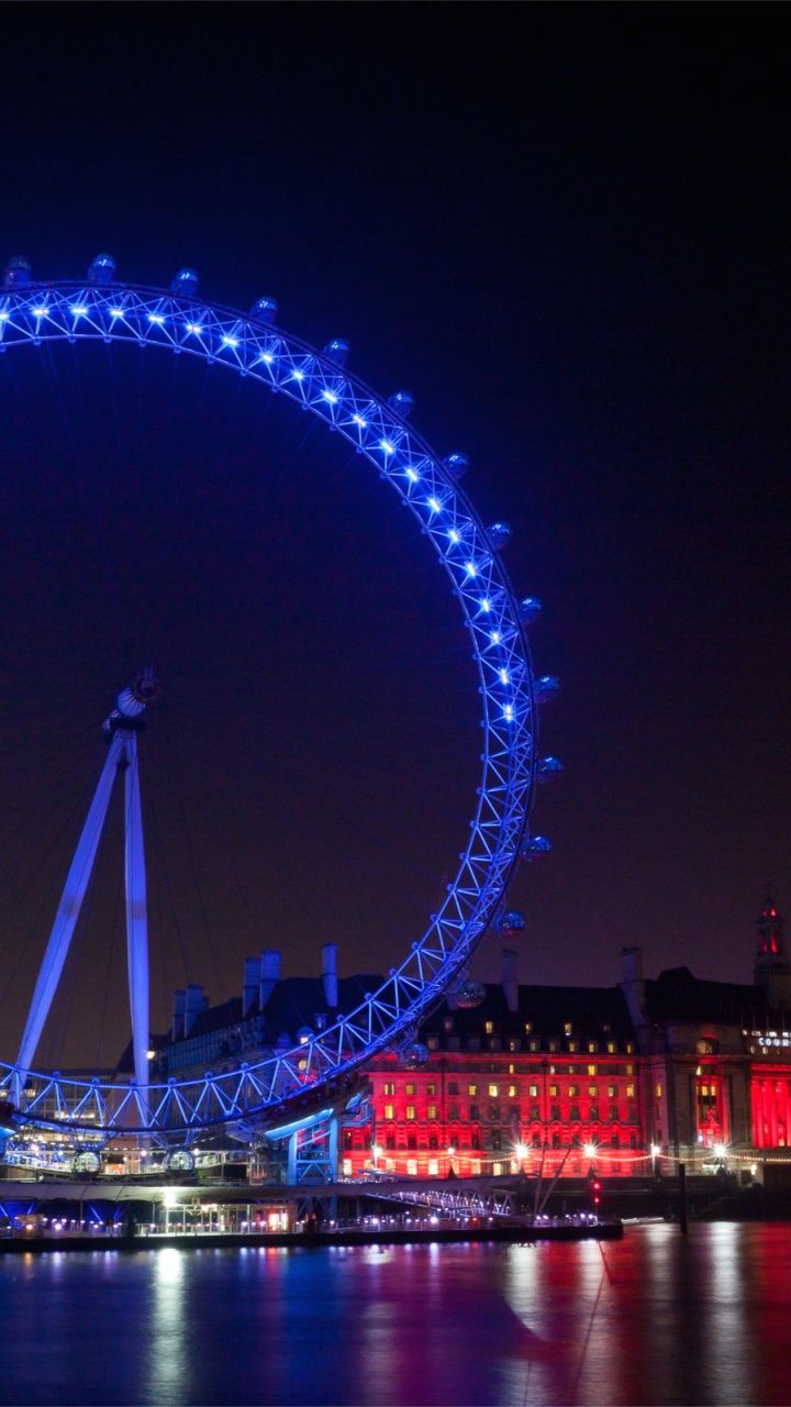 Ferris Wheel Near Body of Water During Night Time. Wallpaper in 720x1280 Resolution