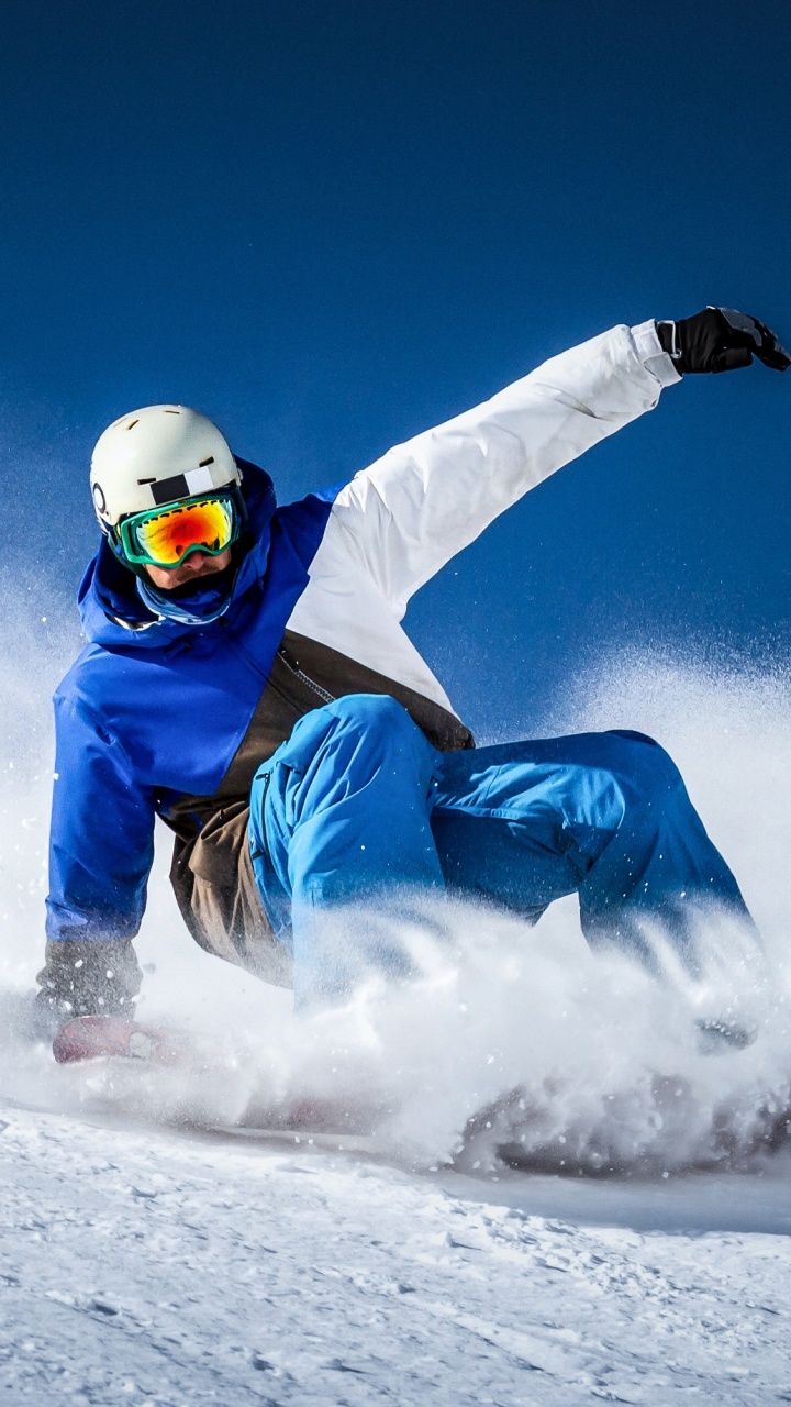 Persona en Traje de Nieve Azul y Blanco Montando Sobre Blanco Nieve Móvil Durante el Día. Wallpaper in 720x1280 Resolution