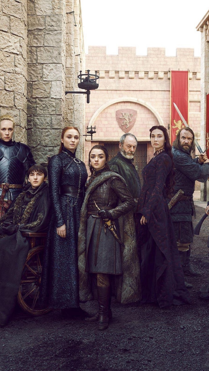 Group of People Standing Near Brown Brick Wall. Wallpaper in 720x1280 Resolution