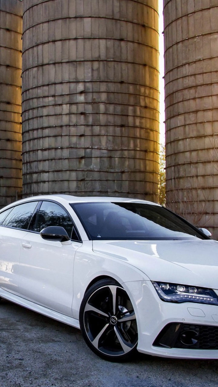 White Porsche 911 Parked Near Brown Brick Wall. Wallpaper in 720x1280 Resolution