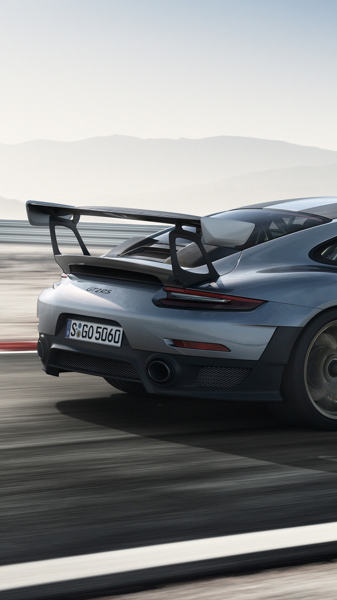 Gray Porsche 911 on Gray Asphalt Road During Daytime. Wallpaper in 1080x1920 Resolution