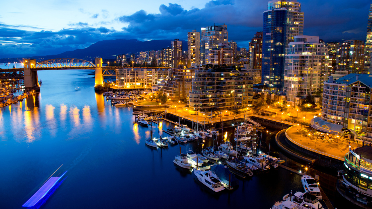 City Skyline Across Body of Water During Night Time. Wallpaper in 1280x720 Resolution