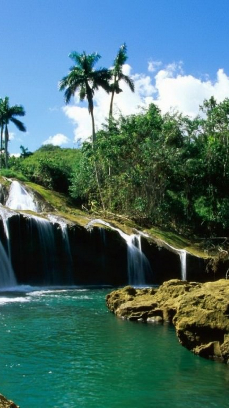 Waterfalls Near Green Trees Under Blue Sky During Daytime. Wallpaper in 750x1334 Resolution